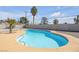 Refreshing in-ground pool with clear blue water and a beautifully landscaped surrounding patio area at 1616 Yellow Rose St, Las Vegas, NV 89108