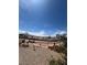 Expansive backyard with desert landscaping, a walkway to upper level, and desert-style plants at 1826 Dunes Ct, Laughlin, NV 89029