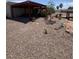 Spacious backyard featuring low-maintenance desert landscaping, covered patio and desert charm at 1826 Dunes Ct, Laughlin, NV 89029