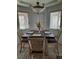 Bright dining room featuring a classic light fixture and a four-seat table at 1826 Dunes Ct, Laughlin, NV 89029