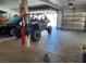 Organized garage space with a vehicle, side-by-side, and ample room for storage at 1826 Dunes Ct, Laughlin, NV 89029