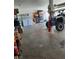 Functional garage setup with laundry area, storage, and space for recreational vehicle at 1826 Dunes Ct, Laughlin, NV 89029