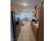Bright kitchen showcasing stainless steel appliances and hardwood cabinetry at 1826 Dunes Ct, Laughlin, NV 89029