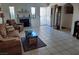 Spacious living room with a fireplace and a comfortable seating area, leading to the entryway at 1826 Dunes Ct, Laughlin, NV 89029