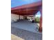Covered patio with ample space for seating, outdoor grill, and desert views at 1826 Dunes Ct, Laughlin, NV 89029