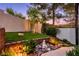 Zen backyard featuring rocks, decorative statues and bushes, for a relaxing and peaceful retreat at 2 Yorkridge Ct, Henderson, NV 89052