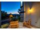 Cozy balcony features two wood Adirondack chairs and a view of the mountains at 2 Yorkridge Ct, Henderson, NV 89052