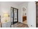 Bright bedroom featuring wood floors and a doorway leading into an ensuite bathroom at 2 Yorkridge Ct, Henderson, NV 89052