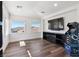 Bright bonus room features hardwood floors, recessed lighting, and a wall-mounted television for entertainment and relaxation at 2 Yorkridge Ct, Henderson, NV 89052