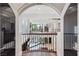 Expansive foyer featuring a high ceiling, an overlook of the downstairs living areas, and wrought iron railings at 2 Yorkridge Ct, Henderson, NV 89052