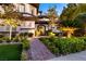Inviting front entrance with decorative metal door and lush landscaping at 2 Yorkridge Ct, Henderson, NV 89052