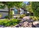 Inviting front exterior with lush landscaping and brick-paved walkway at 2 Yorkridge Ct, Henderson, NV 89052