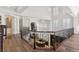 Elegant upper hallway with wood floors, ornate iron railing, and a view of the main floor at 2 Yorkridge Ct, Henderson, NV 89052