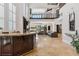 Expansive living room featuring a wet bar, fireplace, soaring ceilings, and seamless access to the outdoor pool at 2 Yorkridge Ct, Henderson, NV 89052