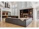 Inviting living room with fireplace, large windows with shutters, and open layout to the kitchen at 2 Yorkridge Ct, Henderson, NV 89052