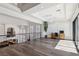 Open and airy living space with hardwood floors, recessed lighting, and large windows at 2 Yorkridge Ct, Henderson, NV 89052