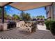 Outdoor kitchen and bar area leading to a relaxing pool and lounge area; perfect for entertaining guests at 2 Yorkridge Ct, Henderson, NV 89052