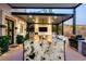 Stylish outdoor kitchen with granite countertop, grill, and covered patio at 2 Yorkridge Ct, Henderson, NV 89052