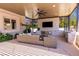Comfortable outdoor living area with fireplace, TV, and seating, perfect for relaxing and entertaining at 2 Yorkridge Ct, Henderson, NV 89052
