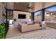 Inviting outdoor living space featuring a covered patio with a fireplace, TV, and outdoor kitchen at 2 Yorkridge Ct, Henderson, NV 89052