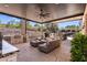 Spacious covered patio with a full outdoor kitchen, comfortable seating, and bar, ideal for outdoor living at 2 Yorkridge Ct, Henderson, NV 89052