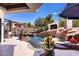 Expansive custom pool features a captivating rock waterfall, surrounded by landscaped gardens and mature trees at 2 Yorkridge Ct, Henderson, NV 89052