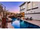 Luxurious pool with rock waterfall feature and elegant patio furniture at 2 Yorkridge Ct, Henderson, NV 89052