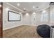 Bright theater room featuring a projector screen, neutral carpet, recessed lighting and plush seating for the ultimate viewing experience at 2 Yorkridge Ct, Henderson, NV 89052