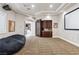 Spacious theater room with large screen, projector, custom cabinets and comfortable seating, perfect for entertaining and relaxation at 2 Yorkridge Ct, Henderson, NV 89052