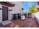 Exterior utility area with a generator, air conditioning units, and an access gate at 2 Yorkridge Ct, Henderson, NV 89052