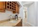 Convenient wet bar area with built-in wine rack, sink, and counter space, perfect for entertaining guests and making coffee at 2 Yorkridge Ct, Henderson, NV 89052