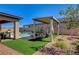 Expansive backyard with pool views, covered patio, dining area and well-maintained landscaping, perfect for outdoor living at 21 Reverie Heights Ave, Henderson, NV 89011