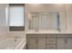 The bathroom features a double vanity, soaking tub, and glass-enclosed shower at 21 Reverie Heights Ave, Henderson, NV 89011