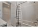 Modern bathroom featuring a shower-tub combo with white subway tile and decorative shower curtain at 21 Reverie Heights Ave, Henderson, NV 89011