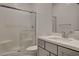 Modern bathroom with a glass-enclosed shower and sleek vanity at 21 Reverie Heights Ave, Henderson, NV 89011