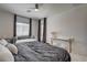 The bright main bedroom has a large window and a seating area with a desk at 21 Reverie Heights Ave, Henderson, NV 89011