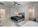 The main bedroom has ensuite bath, ceiling fan, and seating area at 21 Reverie Heights Ave, Henderson, NV 89011