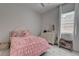 Charming bedroom featuring a cozy bed, natural light, and stylish decor at 21 Reverie Heights Ave, Henderson, NV 89011