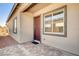 Inviting front door with sidelight windows, a brick-paver patio, and neutral exterior at 21 Reverie Heights Ave, Henderson, NV 89011