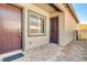 Charming front entrance featuring a brick-paver patio, two entry doors, and modern exterior finishes at 21 Reverie Heights Ave, Henderson, NV 89011