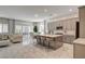 Open kitchen with a large island, counter seating, stainless appliances, and a seamless flow to living spaces at 21 Reverie Heights Ave, Henderson, NV 89011
