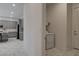 Convenient laundry room with a white washer and shelf, located near the kitchen area at 21 Reverie Heights Ave, Henderson, NV 89011