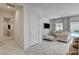 View of the elegant living room with white marble floors and access to a pool at 21 Reverie Heights Ave, Henderson, NV 89011