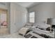 Cozy office space with white accents, white lounge chair, and closet space at 21 Reverie Heights Ave, Henderson, NV 89011