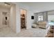View of the pantry with white shelving beside the elegant living room at 21 Reverie Heights Ave, Henderson, NV 89011