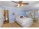 Comfortable bedroom with mirrored closet doors, a ceiling fan, and an open doorway at 2112 Preakness Pass, Las Vegas, NV 89117