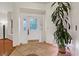 Inviting entryway with decorative tile flooring, a front door with glass, and bright white walls at 2112 Preakness Pass, Las Vegas, NV 89117