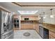 Modern kitchen featuring stainless steel appliances, granite countertops, and custom cabinetry at 2112 Preakness Pass, Las Vegas, NV 89117