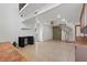 Open floor plan living room with spiral staircase, recessed lighting, and tile flooring at 2112 Preakness Pass, Las Vegas, NV 89117