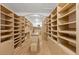 Large walk-in closet featuring custom shelving, built-in storage, and ample space at 2112 Preakness Pass, Las Vegas, NV 89117
